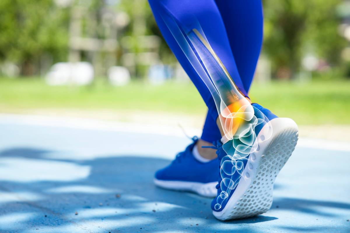 Woman suffering from an ankle injury